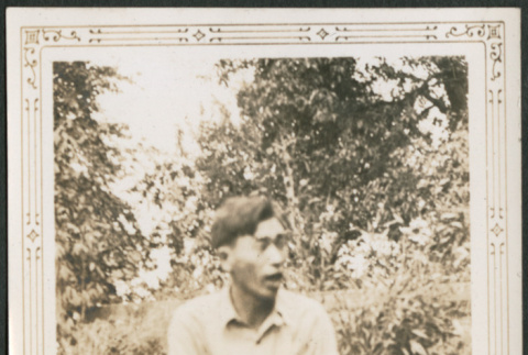 Man sitting on grass (ddr-densho-316-226)