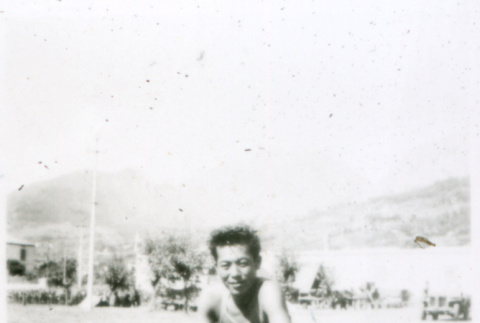 Boy squatting in field (ddr-densho-1007-774)