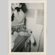 Suzanna holding a phone (ddr-densho-37-971)