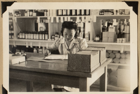 Mary working at a desk (ddr-densho-542-534)
