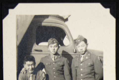 Three soldiers by a truck (ddr-densho-542-633)