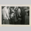 Family ready to board a train (ddr-densho-37-911)