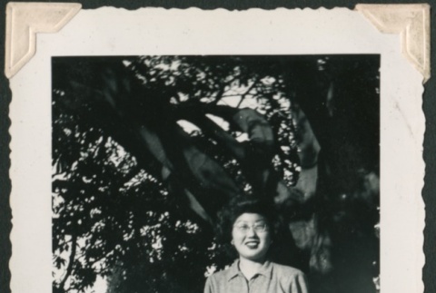 Woman standing under a tree (ddr-densho-321-200)