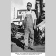 Man standing in overalls (ddr-ajah-6-420)