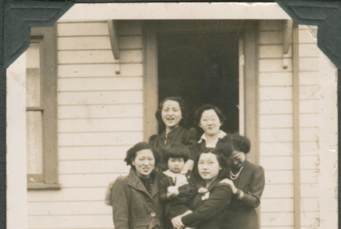 Five women and girl posing on steps (ddr-densho-316-371)