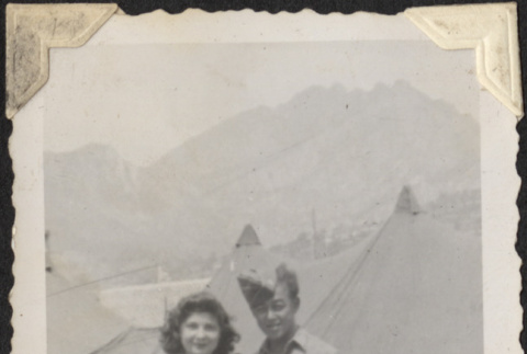 Couple standing outside tents (ddr-densho-466-899)