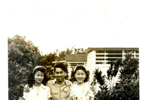 Danny Y. Teruda with two women (ddr-densho-22-283)