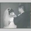 groom feeding bride a piece of cake (ddr-densho-523-348)