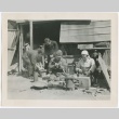 Japanese men and women working in front of a shack (ddr-densho-299-50)