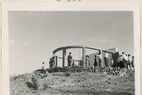 Crowd at monument flagpole (ddr-densho-37-1471)