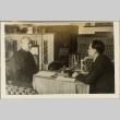 Two men at a table with calligraphy tools (ddr-njpa-13-1286)