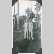 Two men standing by trees.  Joe Iwataki on left (ddr-ajah-2-662)