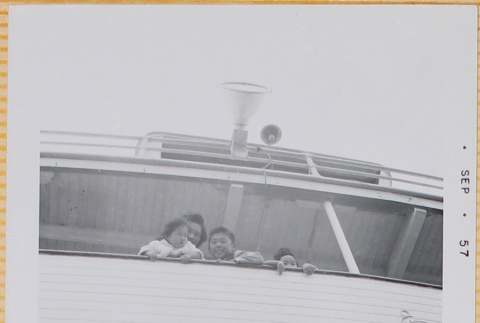 Yoshiko, Leslie, Susan and William Shiomi on boat (ddr-densho-522-429)