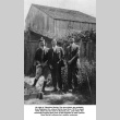 Three men standing in yard (ddr-ajah-6-622)