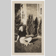 Woman sitting in the yard (ddr-densho-335-162)