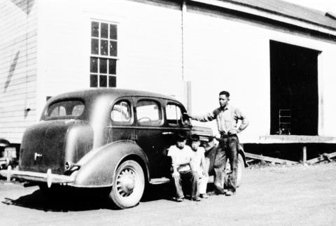 Father and children in front of car (ddr-densho-78-2)