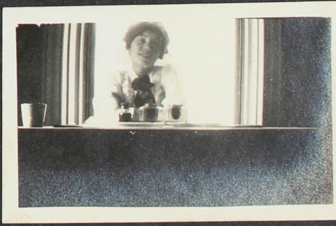 Woman sitting at a table (ddr-densho-355-740)