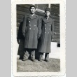 Two soldiers in front of a building (ddr-densho-22-169)