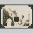 man and two women outside a house (ddr-densho-378-487)