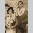 Husband and wife posing with leis (ddr-njpa-4-1504)