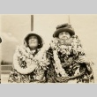 Victor S. K. Houston and wife wearing many leis (ddr-njpa-2-436)