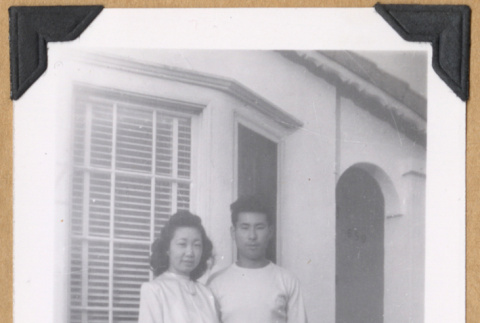 Woman and man outside a building (ddr-densho-542-313)