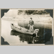 Man in small motorboat near shore (ddr-densho-383-242)