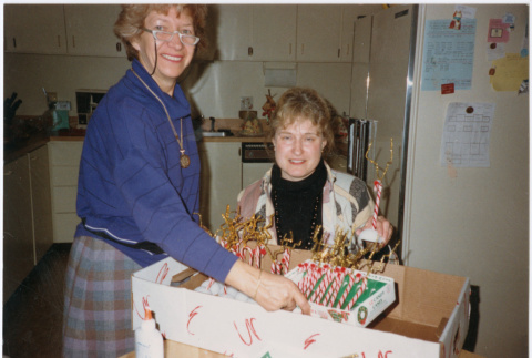 Two women in Christmas decorations (ddr-densho-534-63)