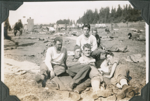 Five men sitting in field with camp gear.  Joe Iwataki on right (ddr-ajah-2-246)