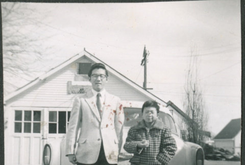 Two Sakura brothers in front of car (ddr-densho-523-263)