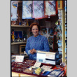 Woman in souvenir stall (ddr-densho-426-714)