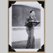 Tokeo Tagami stands at a lectern (ddr-densho-404-377)