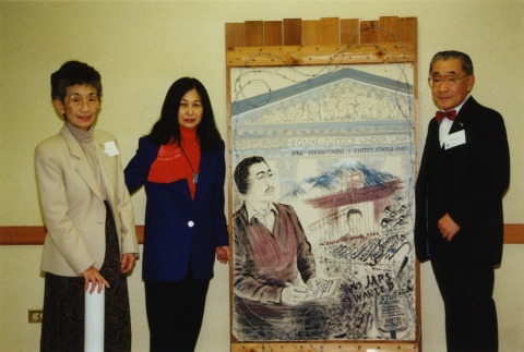A group standing next to a piece of art (ddr-densho-26-33)
