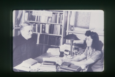 (Slide) - Image of priest and woman sitting at table (ddr-densho-330-36-master-54a5db426f)