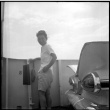 Woman standing on ferry deck (ddr-densho-329-699)