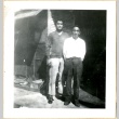 Two men in front of barracks (ddr-manz-6-8)