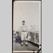 Young man in uniform on ship (ddr-densho-326-100)