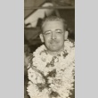 A man wearing leis (ddr-njpa-1-2484)
