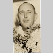 A man wearing leis (ddr-njpa-1-1374)