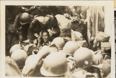 Woman surrounded by soldiers (ddr-densho-466-410)