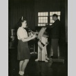 Japanese American playing the clarinet (ddr-densho-159-69)