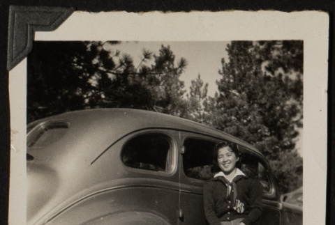 Mits poses with a car (ddr-densho-542-375)