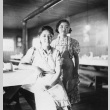Two Nisei women in a mess hall (ddr-densho-154-4)
