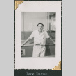 Man standing by countertop (ddr-densho-434-149)