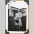Mick standing outside a building (ddr-densho-542-309)