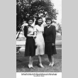 Three women standing in yard (ddr-ajah-6-344)