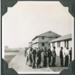 Group of men lined up outside building (ddr-ajah-2-109)