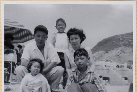 Family on beach (ddr-densho-522-298)