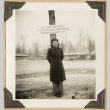 Mits poses next to a lumber sign (ddr-densho-542-403)
