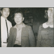 Three people, man with checkered jacket (ddr-densho-523-445)